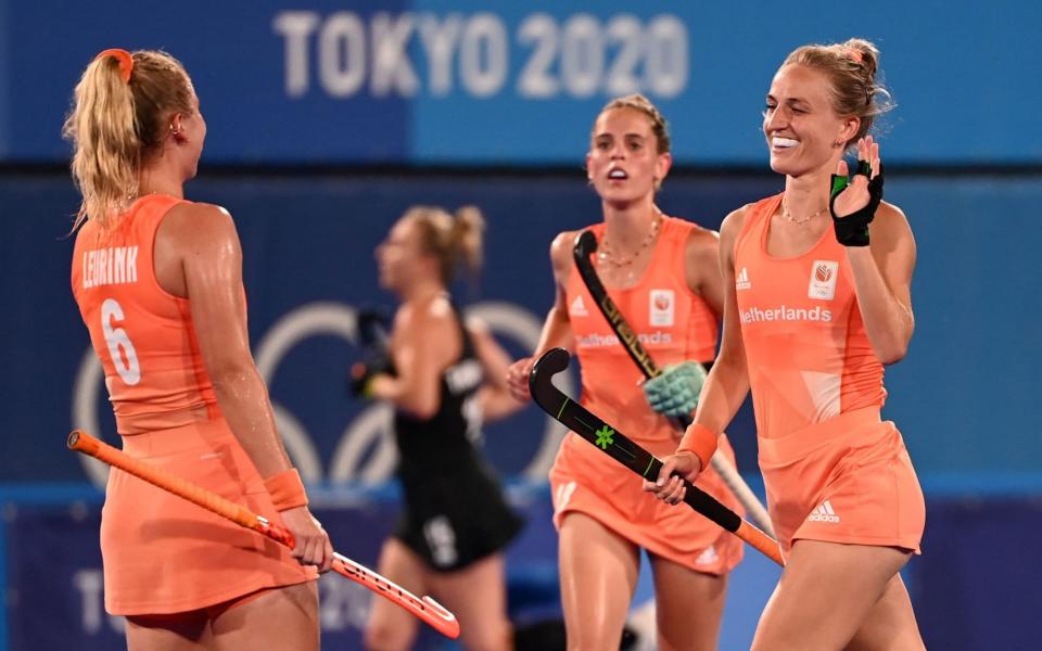Netherlands' Lauren Lara Jeanette Stam (R) celebrates with teammate Laurien Leurink after scoring against New Zealand in the impressive quarter-final win  - GETTY IMAGES