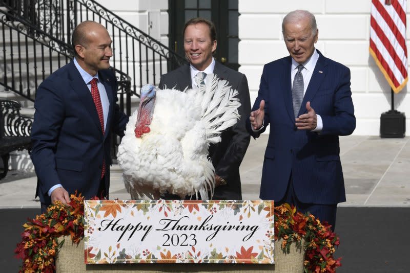 President Joe Biden gestures during a ceremony to pardon the Thanksgiving turkey, Liberty, at the White House, Monday alongside Steve Lykken, chairman of the National Turkey Federation and Jose Rojas, vice president of Jennie-O Turkey Store. Photo by Mike Theiler/UPI