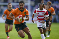 Australia's Tom Wright runs in to score his team's first try during the rugby international between the Wallabies and Japan in Oita, Japan, Saturday, Oct. 23, 2021. (AP Photo/Hiro Komae)