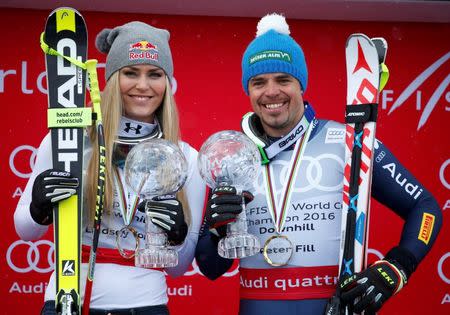 Alpine Skiing - Alpine Skiing World Cup - Women's Downhill and Men's Downhill World Cup victory ceremony - St. Moritz, Switzerland - 16/3/16 - Lindsey Vonn from the U.S. and Peter Fill react REUTERS/Arnd Wiegmann