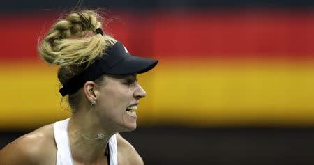 Germany's Angelique Kerber serves to Czech Republic's Petra Kvitova during their final match of the Fed Cup tennis tournament in Prague November 9, 2014. REUTERS/David W Cerny