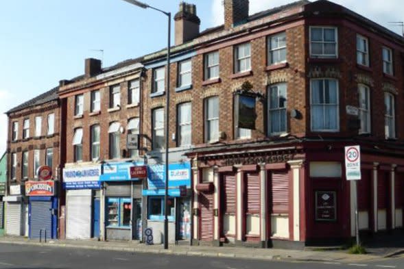 Boarded up shops in Picton, Liverpool.