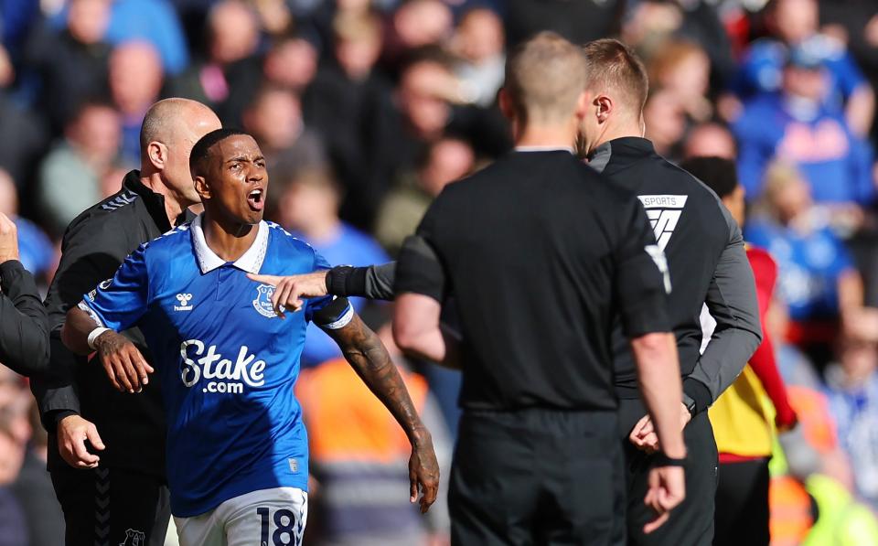 Ashley Young of Everton reacts as he is sent off after being shown a red card