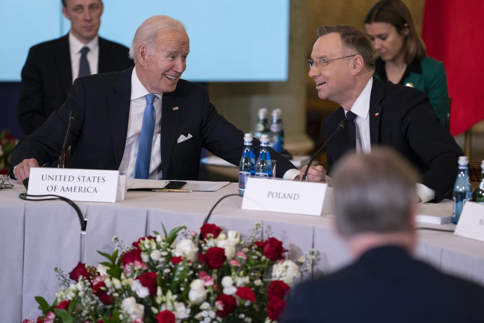 President Joe Biden talks with Polish President Andrzej Duda during a meeting with the leaders of the Bucharest Nine, a group of nine countries that make up the eastern flank of NATO, Wednesday, Feb. 22, 2023, in Warsaw. (AP Photo/ Evan Vucci)