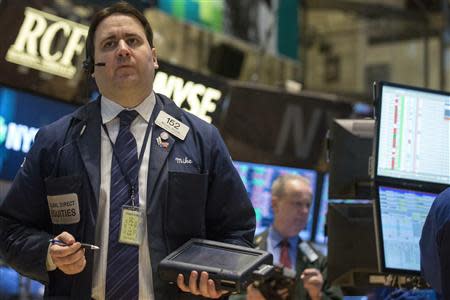 Traders work on the floor of the New York Stock Exchange March 20, 2014. REUTERS/Brendan McDermid