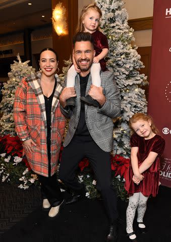 <p>Jon Kopaloff/Getty</p> Aijia Grammer, Andy Grammer and their daughters attend CBS Presents: A Home For the Holidays on November 20, 2022 in Los Angeles, California.