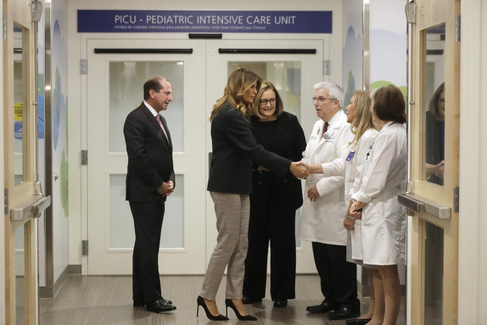 First lady Melania Trump, second from left, greets Pediatric Intensive Care Unit nurse manager Karan Barry, second from right, as U.S. Secretary of Health and Human Services Alex Azar, left, President and CEO of Boston Medical Center Kate Walsh, third from left, Chief of Pediatrics Bob Vinci, third from right, and pediatrician Eileen Costello, right, look on during a visit to Boston Medical Center, in Boston, Wednesday, Nov. 6, 2019. The visit, part of the first lady's "Be Best" initiative, included the hospital's pediatric intensive care unit. (AP Photo/Steven Senne, Pool)