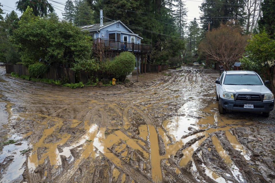 Muddy streets in the Felton Grove neighborhood of Felton, Calif., Tuesday, Jan. 10, 2023. (AP Photo/Nic Coury)