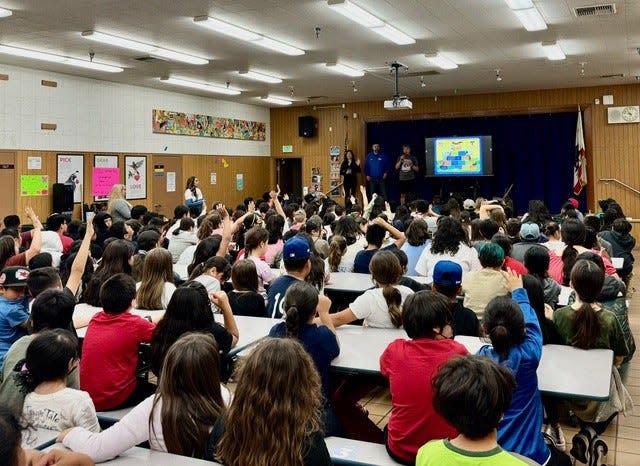 Students from Della S. Lindley Elementary School in Thousand Palms participate in a character education assembly arranged by Harper for Kids, featuring special guest Ric Coy.