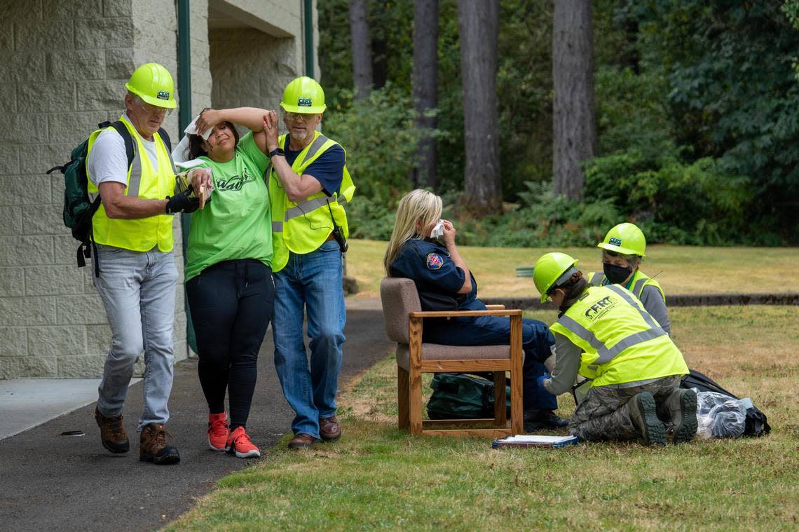 The first graduating class of Gig Harbor’s community emergency response team practices what they have learned during a simulated scenario with mock victims in Gig Harbor on Saturday Aug. 13, 2022.