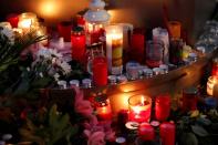 People place candles at central market square in Halle