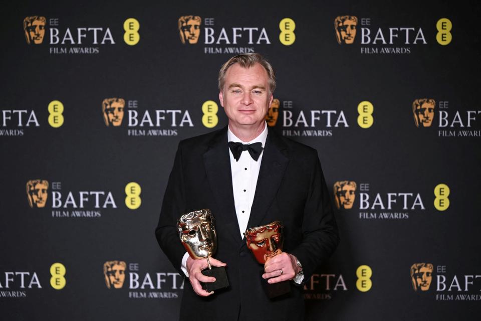 TOPSHOT - British film producer and director Christopher Nolan poses with the award for Best film and Best director for "Oppenheimer" during the BAFTA British Academy Film Awards ceremony at the Royal Festival Hall, Southbank Centre, in London, on February 18, 2024. (Photo by JUSTIN TALLIS / AFP) (Photo by JUSTIN TALLIS/AFP via Getty Images) ORG XMIT: 776102401 ORIG FILE ID: 2013756835