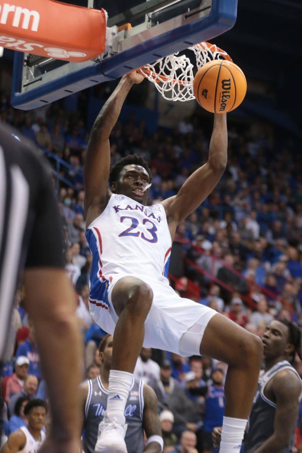 Kansas freshman center Ernest Udeh Jr. (23) slams the ball in for a dunk over Seton Hall during the second half of Thursday's game inside Allen Fieldhouse.