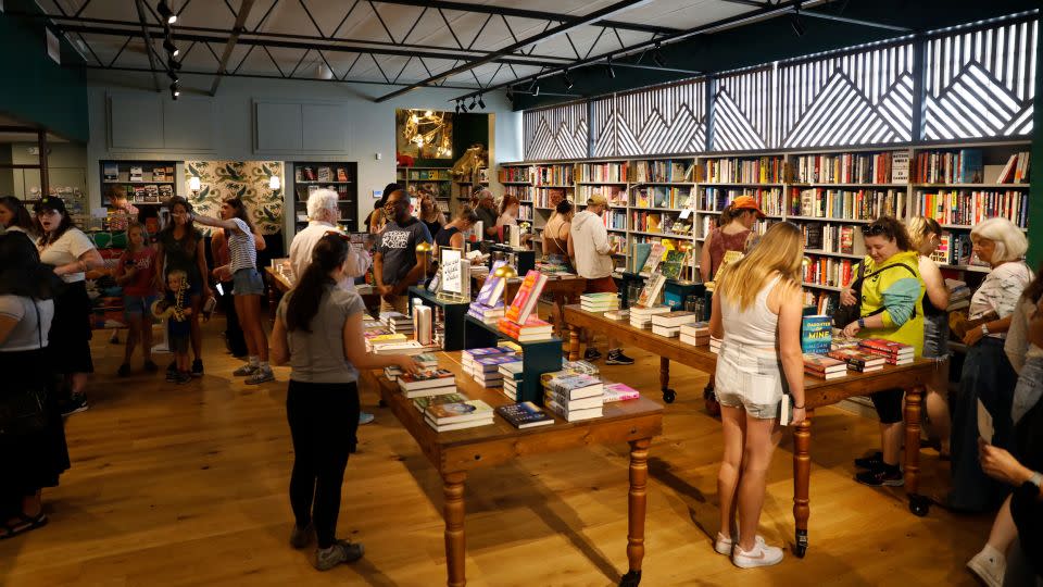 Customers browse for books during the grand opening of The Lynx. From the first few minutes of its opening, the store reached capacity, and a growing line waited out back to be let in. - Octavio Jones for CNN