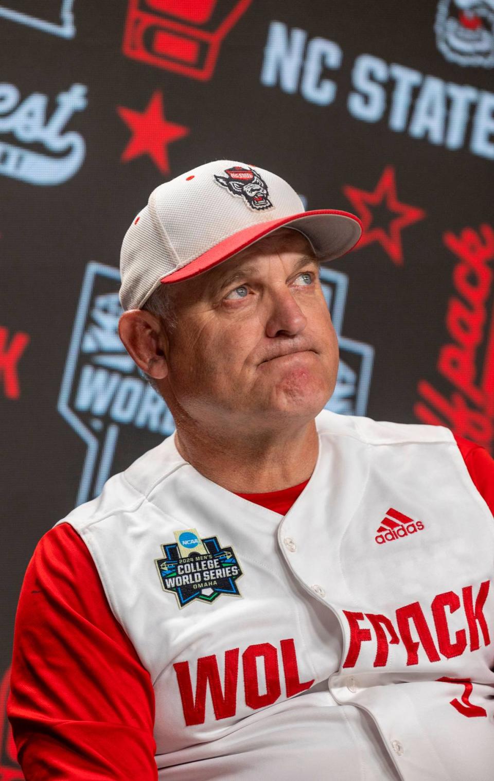 N.C. State coach Elliott Avent listens to his players during interviews with the media following the Wolfpack’s 5-4 season ending loss to Florida in game seven of the College World Series on Monday, June 17, 2024 at Charles Schwab Field in Omaha, Nebraska.