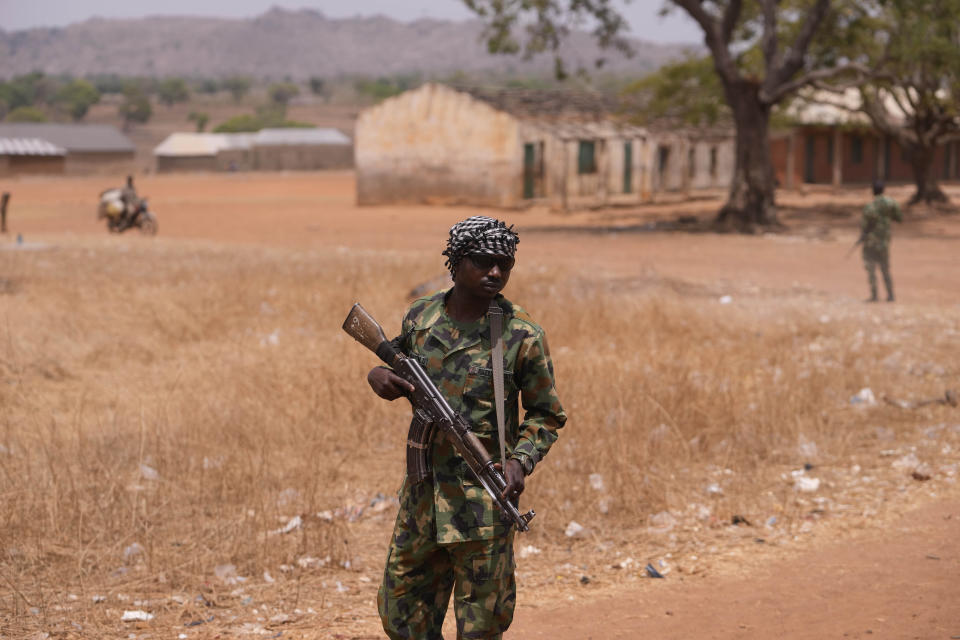 A Nigerian Soldier patrol sat the LEA Primary and Secondary School Kuriga where students were kidnapped in Kuriga, Kaduna Nigeria, Saturday, March 9, 2024. Security forces swept through large forests in Nigeria's northwest region on Friday in search of nearly 300 children who were abducted from their school a day earlier in the West African nation's latest mass kidnap which analysts and activists blamed on the failure of intelligence and slow security response. (AP Photo/Sunday Alamba )