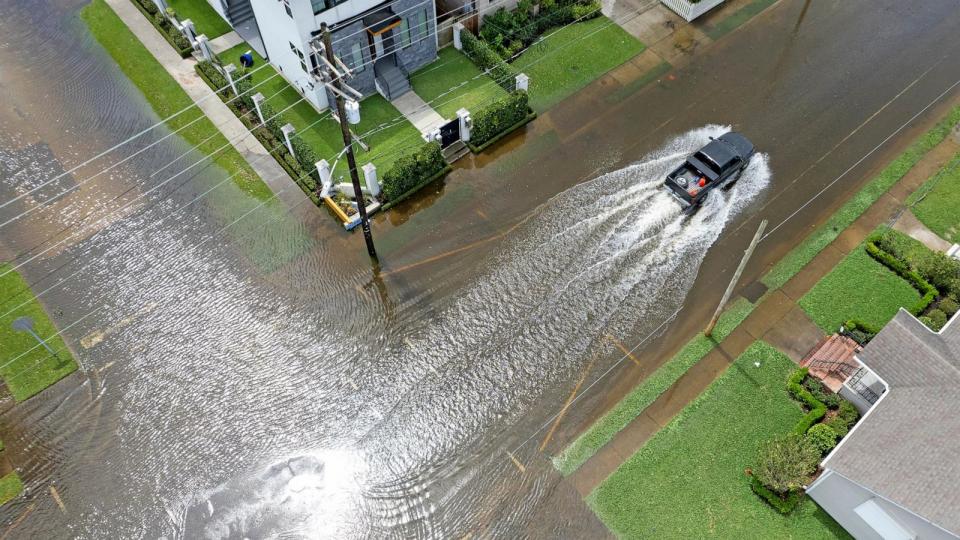 PHOTO: In this Aug. 30, 2021, file photo, a truck drives through flooded streets in the Lakeview neighborhood of New Orleans after Hurricane Ida.  (Michael Democker via USA Today Network)