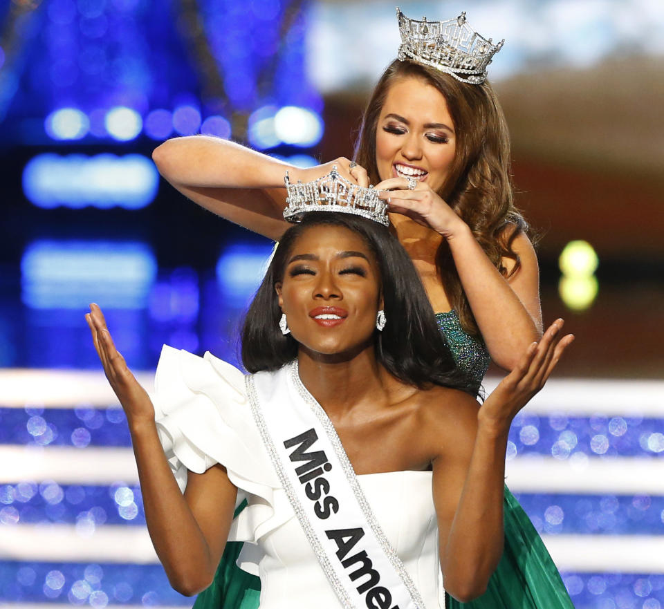 Miss New York Nia Franklin reacts after being named Miss America 2019, as she is crowned by last year's winner Cara Mund, Sunday, Sept. 9, 2018, in Atlantic City, N.J. (AP Photo/Noah K. Murray)