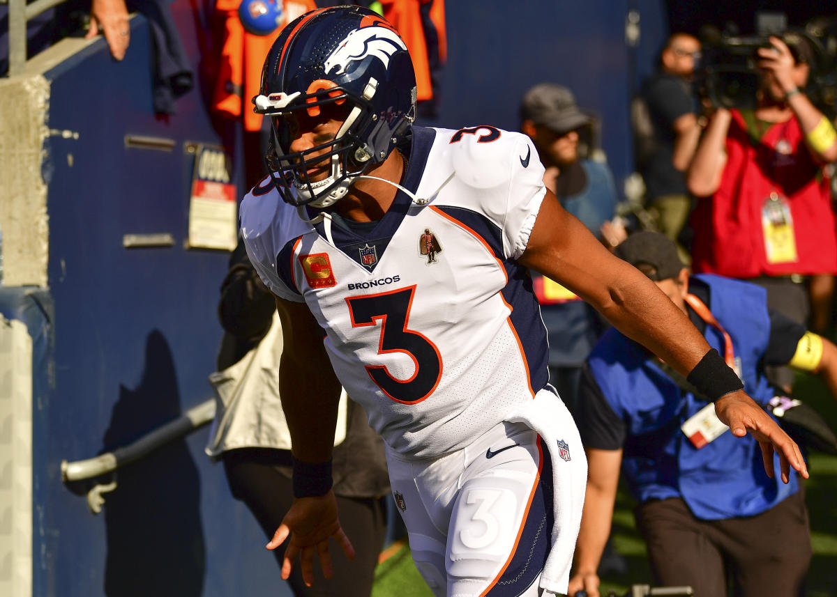 Broncos Russell Wilson greets some Seahawks, 1st fans in boo