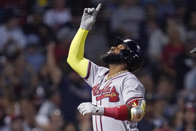 Atlanta Braves' Marcell Ozuna points upwards while crossing home plate on his three-run home run off Boston Red Sox starting pitcher Nick Pivetta during the fourth inning of a baseball game Wednesday, Aug. 10, 2022, in Boston. (AP Photo/Charles Krupa)