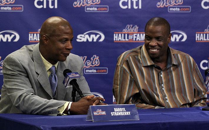 Darryl Strawberry (left) and Dwight Gooden (right) share a moment at Citi Field in 2010. (Getty Images)