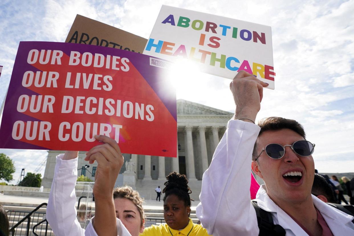 <span>Abortion rights supporters in front of the US supreme court building on 24 April 2024.</span><span>Photograph: Kevin Lamarque/Reuters</span>