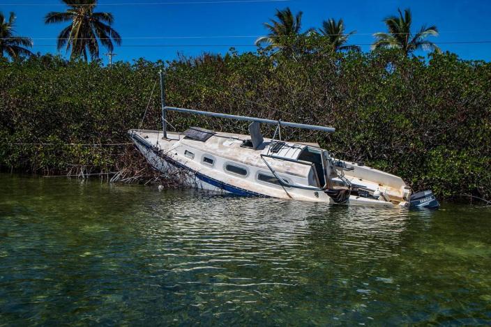 A sailboat sits in the mangroves on Sugarloaf Key Thursday, Oct. 27, 2022. It is one of more than 100 boats that were displaced when Hurricane Ian went by the Florida Keys Tuesday, Sept. 27, 2022.