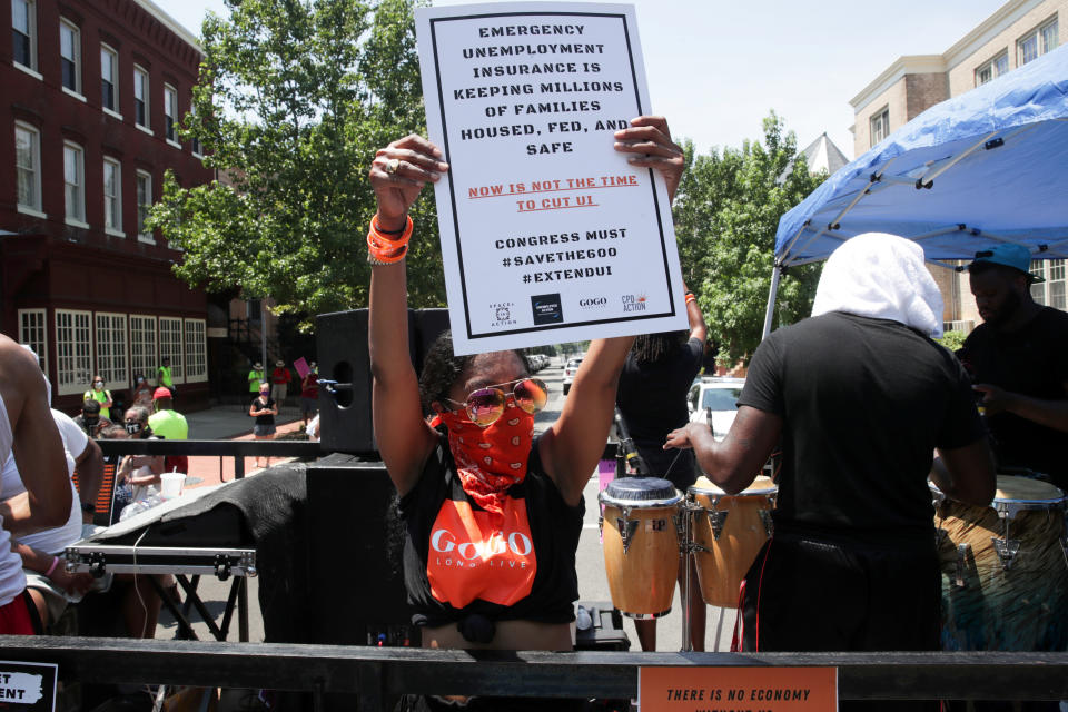 Protesters block the street to Senate Majority Leader Mitch McConnell's Washington, D.C., house on July 22, demanding the extension of coronavirus-related unemployment aid. (Photo: Jonathan Ernst/Reuters)