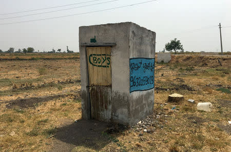 A toilet is pictured in a field outside a school near Jaikisan Camp village in the southern state of Karnataka, India, India, April 30, 2019. REUTERS/Sachin Ravikumar