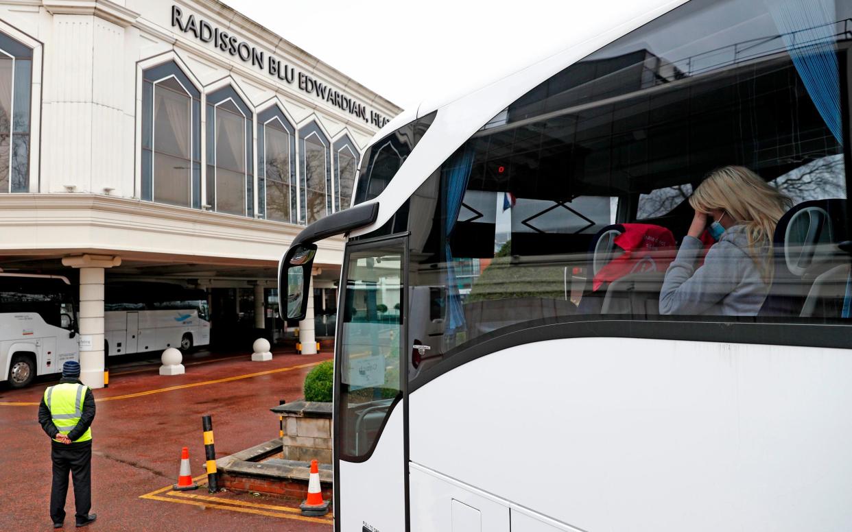 Travellers from a red list country arrive at a hotel quarantine facility near Heathrow - Getty