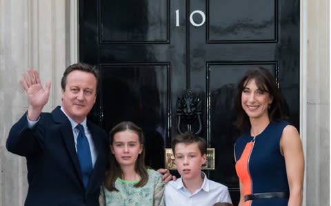 The Cameron family outside their old home, somewhere in London - Credit: Nils Jorgensen/REX/Shutterstock
