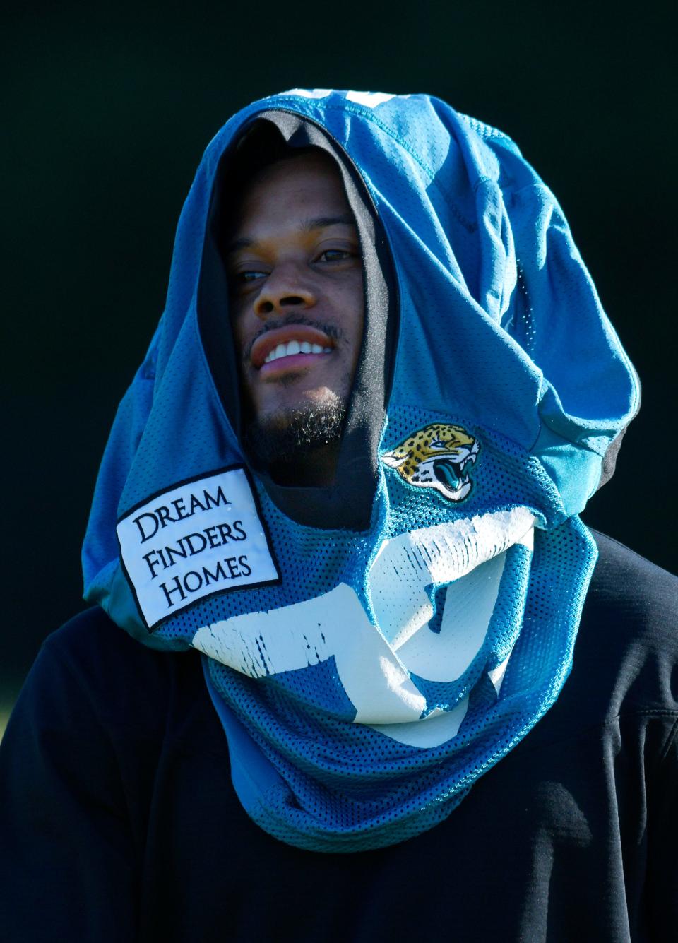 Jacksonville Jaguars wide receiver Jamal Agnew (39) uses his jersey as a sun shade as he gets ready for the start of Wednesday morning's training camp session. The Jacksonville Jaguars held their third day of training camp Wednesday, July 27, 2022, at the Episcopal School of Jacksonville Knight Campus practice fields on Atlantic Blvd. 