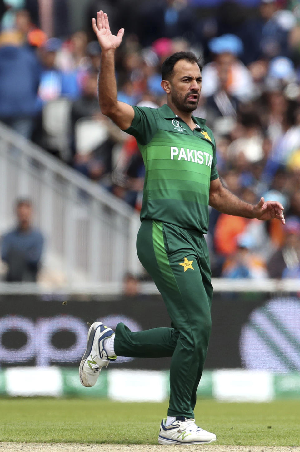 Pakistan's Wahab Riaz reacts after bowling a delivery to India's captain Virat Kohli during the Cricket World Cup match between India and Pakistan at Old Trafford in Manchester, England, Sunday, June 16, 2019. (AP Photo/Aijaz Rahi)