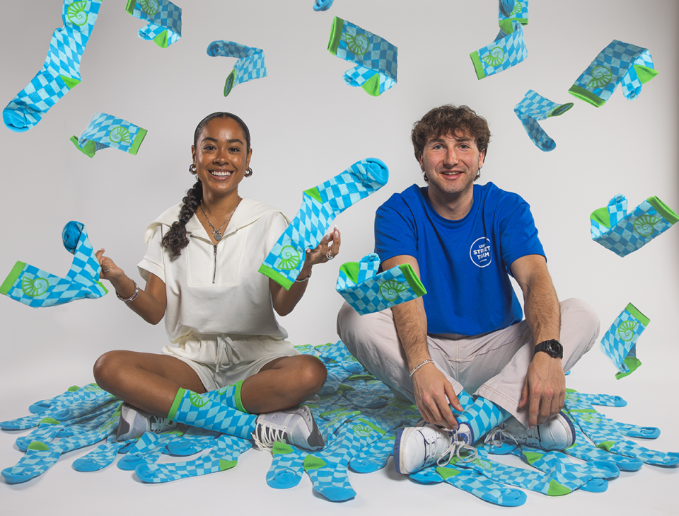 University of West Florida students wearing the 2024 exclusive Day of Giving socks.