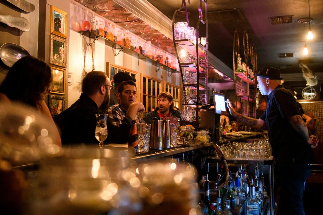 Fully vaccinated customers gather at the bar inside Risky Business, that was once The Other Door but closed during the Covid-19 pandemic in the North Hollywood neighborhood of Los Angeles, California on May 21, 2021.  (Patrick T. Fallon/AFP via Getty Images)