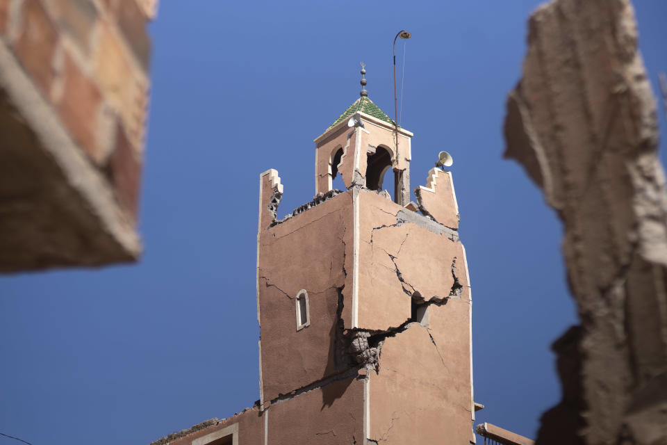 A cracked mosque minaret stands after an earthquake in Moulay Brahim village, near Marrakech, Morocco, Saturday, Sept. 9, 2023. A rare, powerful earthquake struck Morocco late Friday night, killing more than 800 people and damaging buildings from villages in the Atlas Mountains to the historic city of Marrakech. But the full toll was not known as rescuers struggled to get through boulder-strewn roads to the remote mountain villages hit hardest. (AP Photo/Mosa'ab Elshamy)