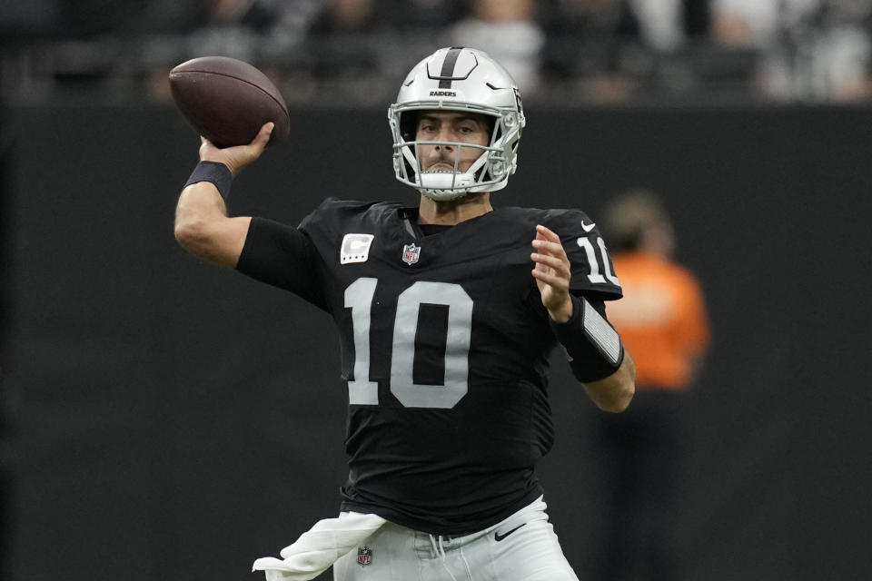 Las Vegas Raiders quarterback Jimmy Garoppolo throws a pass during the first half of an NFL football game against the New England Patriots, Sunday, Oct. 15, 2023, in Las Vegas. (AP Photo/John Locher)