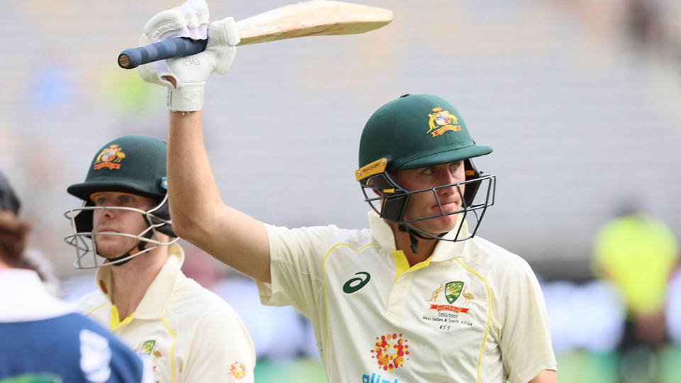 Marnus Labuschagne raises his bat to the crowd at the end of day one at the first Test between Australia and the West Indies.