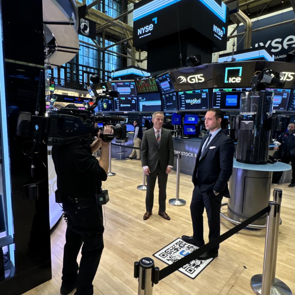 Whirlpool chairman and CEO Marc Bitzer (far left) told investors on Tuesday the company sees a path to better profit margins this year and into 2026. Here he talks with Yahoo Finance Executive Editor Brian Sozzi (right) moments after completing his investor presentations at the New York Stock Exchange.