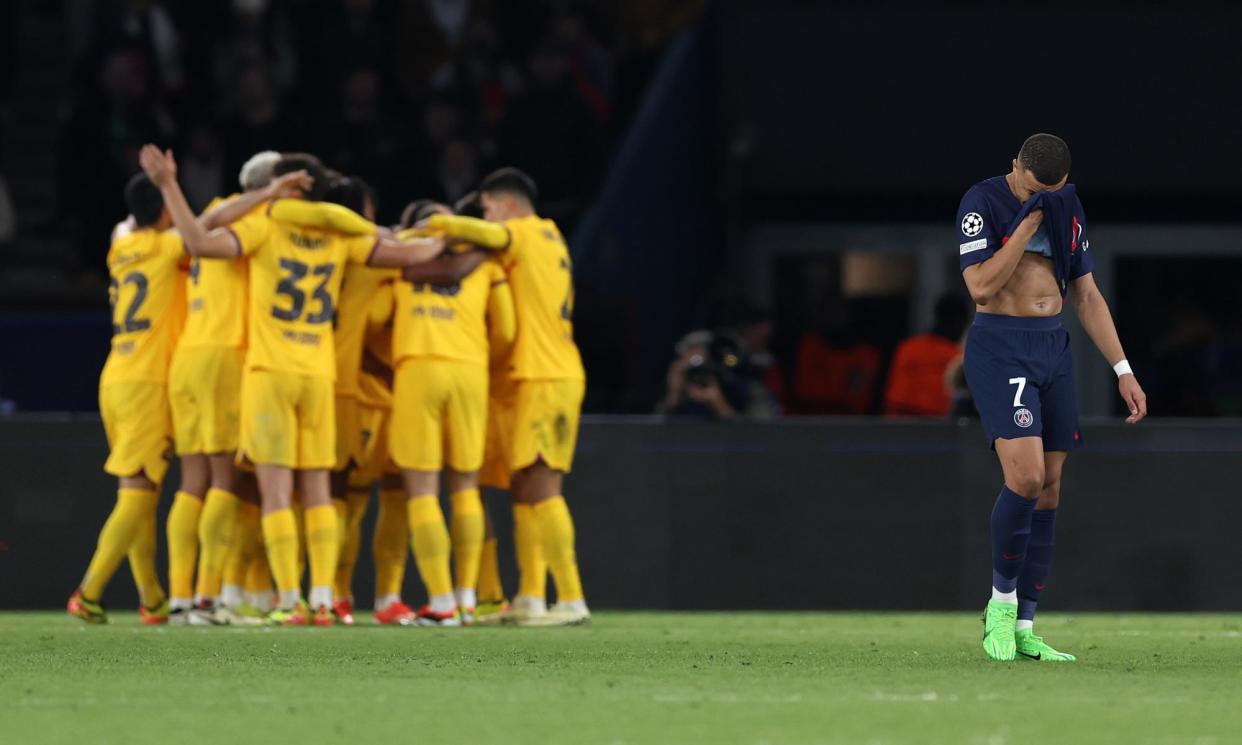 <span>Barcelona players mob Andreas Christensen after his decisive header as Kylian Mbappé walks away in disgust.</span><span>Photograph: Alex Pantling/Getty Images</span>