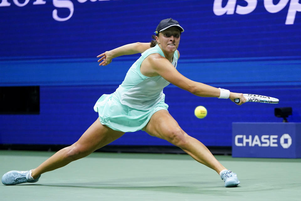 Iga Swiatek, of Poland, returns a shot to Aryna Sabalenka, of Belarus, during the semifinals of the U.S. Open tennis championships, Thursday, Sept. 8, 2022, in New York. (AP Photo/Frank Franklin II)