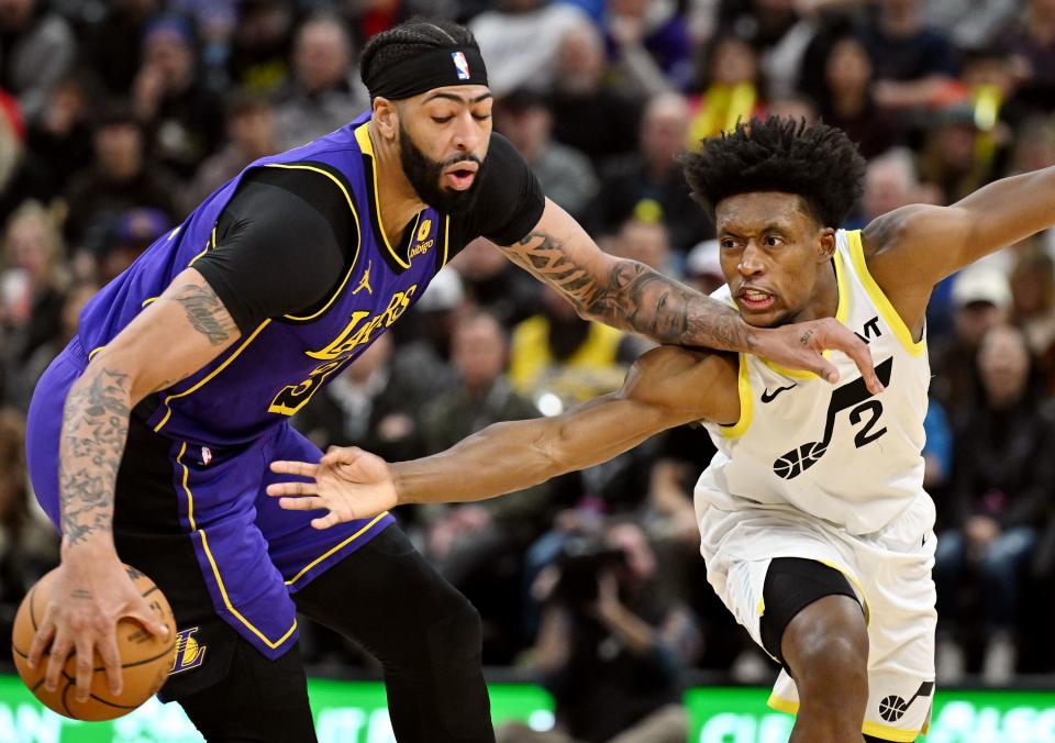 Los Angeles Lakers forward Anthony Davis (3) spins away from Utah Jazz guard Collin Sexton (2) as Utah and Los Angeles play at the Delta Center in Salt Lake City on Saturday, Jan. 13, 2024. | Scott G Winterton, Deseret News