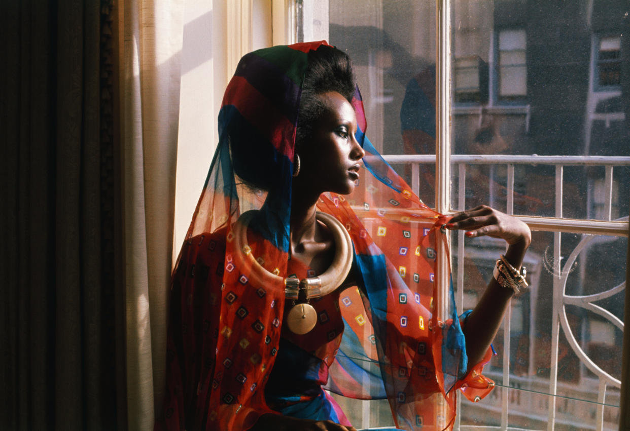 Fashion Model Iman by Window (Bettmann Archive via Getty Images)