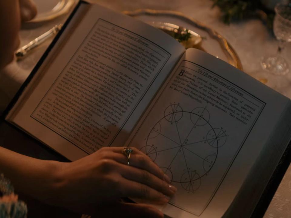 The astronomy book Charlotte reads in episode two.