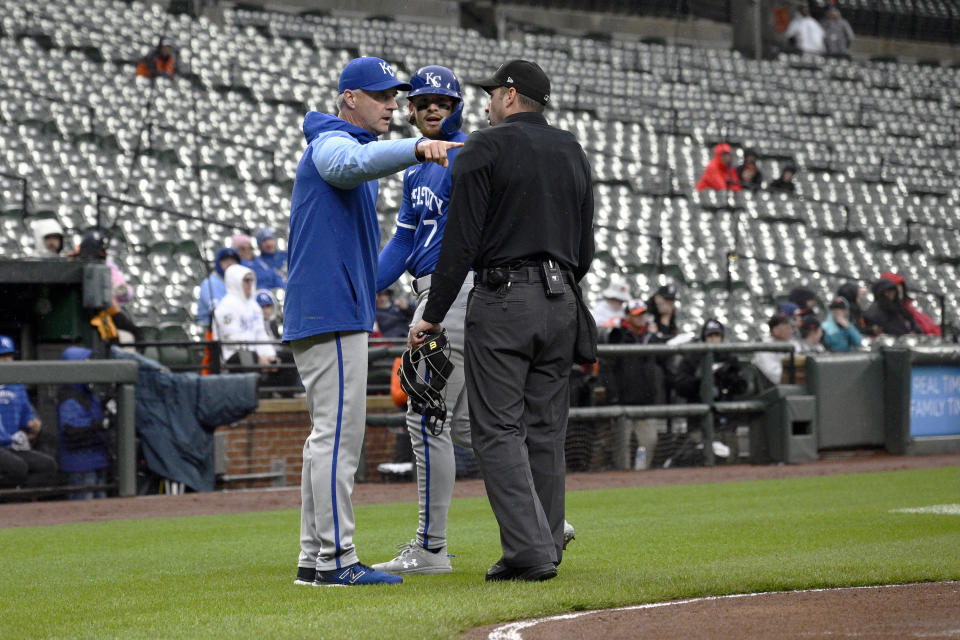 Kansas City Royals manager Matt Quatraro, left, argues with home plate umpire Paul Clemons, right, after a play where Bobby Witt Jr. (7) was tagged out in a rundown between third and home against the Baltimore Orioles during the first inning of a baseball game, Wednesday, April 3, 2024, in Baltimore. (AP Photo/Nick Wass)
