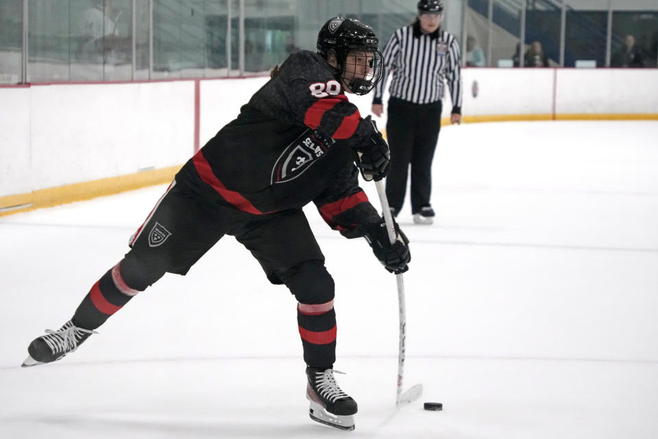 Bishop Kearney Selects Under-19 girls team winger Nela Lopusanova gets off a shot on goal during a Labor Day Weekend hockey tournament in Pittsburgh, Friday, Sept. 1, 2023. (AP Photo/Gene J. Puskar)