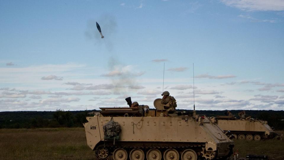 U.S. Army soldiers fire mortars from a cannon mounted on a M113 armored personnel carrier in the Fort Hood training area. (Staff Sgt. Jennifer Bunn/U.S. Army)