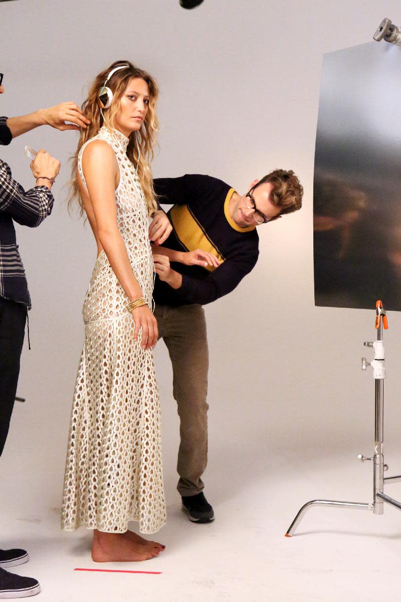 This undated publicity image released by Bravo shows stylist Brad Goreski adjusting an outfit in a scene from "It's a Brad, Brad World," in Los Angeles, airing Wednesdays at 10 p.m. EST. (AP Photo/Bravo, Evans Vestal Ward)