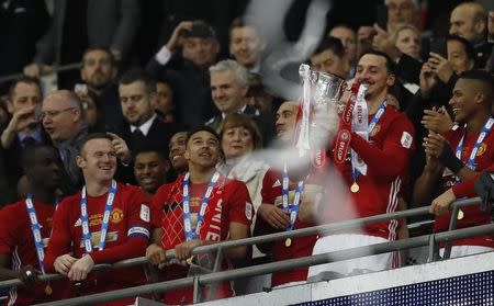 Britain Soccer Football - Southampton v Manchester United - EFL Cup Final - Wembley Stadium - 26/2/17 Manchester United's Zlatan Ibrahimovic lifts the trophy to celebrate winning Action Images via Reuters / Carl Recine