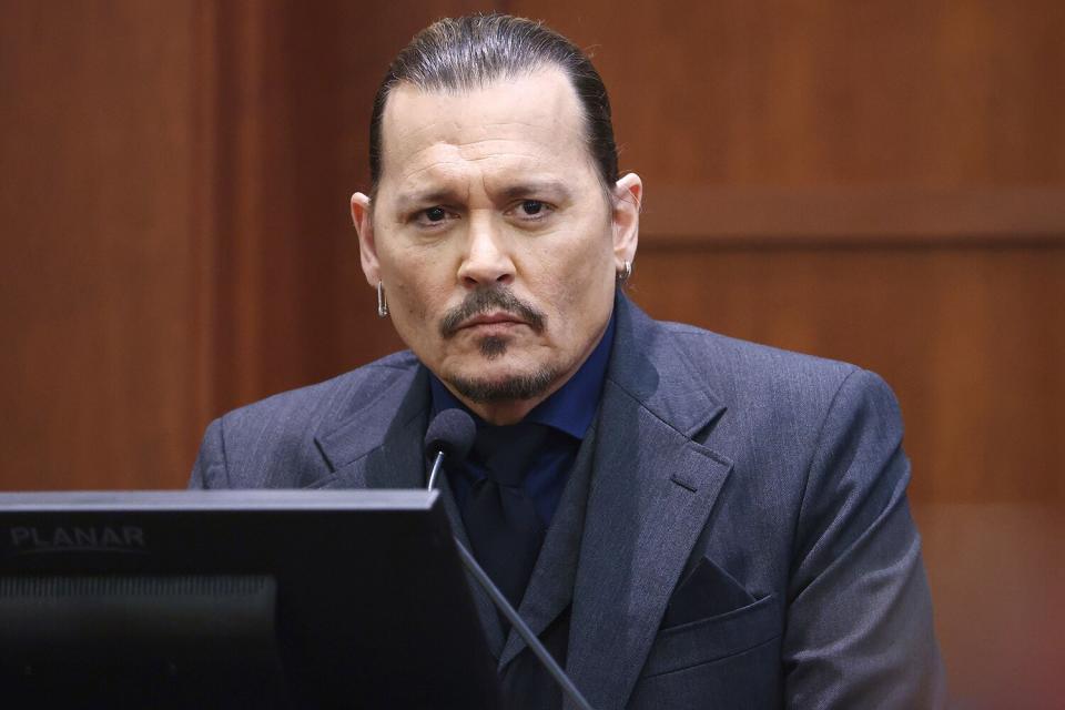 Actor Johnny Depp listens as he testifies in the courtroom at the Fairfax County Circuit Court in Fairfax, Va., . Actor Johnny Depp sued his ex-wife Amber Heard for libel in Fairfax County Circuit Court after she wrote an op-ed piece in The Washington Post in 2018 referring to herself as a "public figure representing domestic abuse